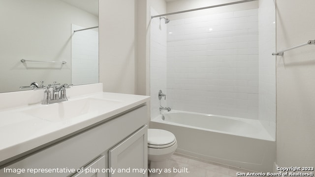 full bathroom with tiled shower / bath, vanity, and toilet