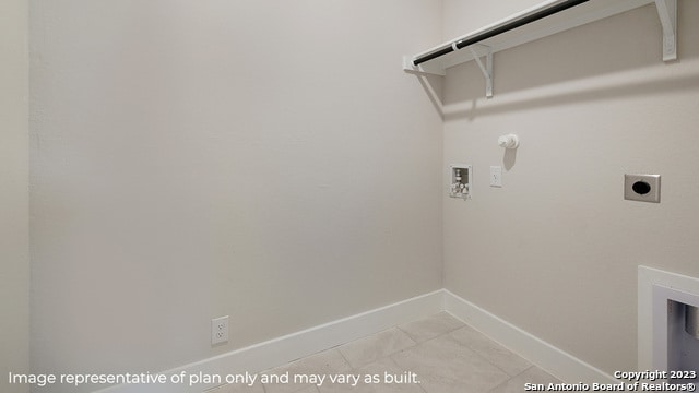 clothes washing area with hookup for an electric dryer, hookup for a washing machine, baseboards, and hookup for a gas dryer