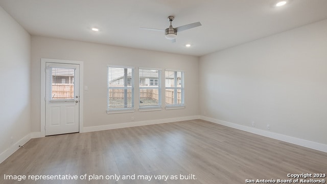unfurnished room with a ceiling fan, light wood-style floors, recessed lighting, and baseboards