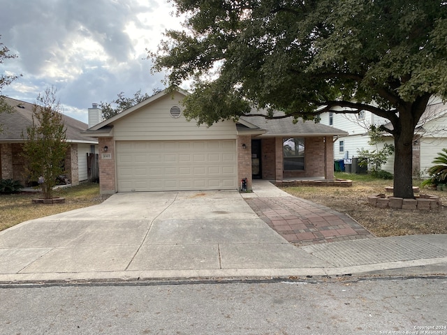 ranch-style house featuring a garage