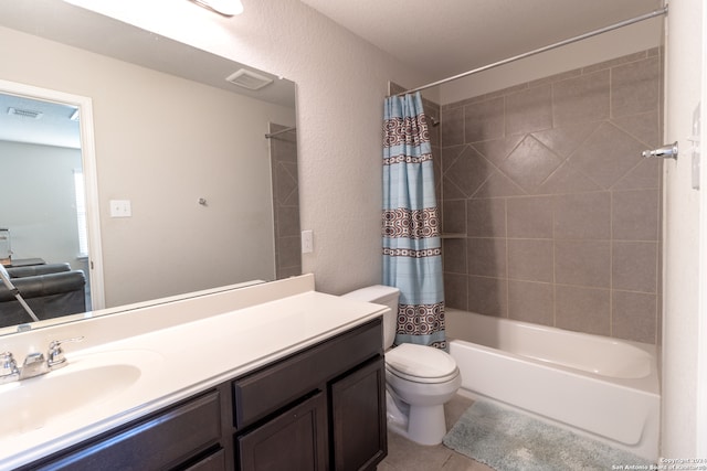 full bathroom featuring shower / tub combo with curtain, vanity, toilet, and tile patterned floors