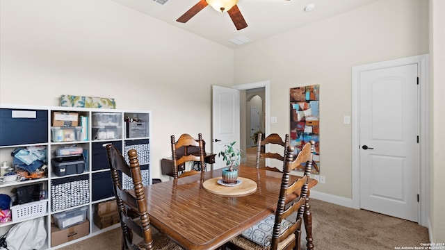 dining room featuring ceiling fan and carpet floors