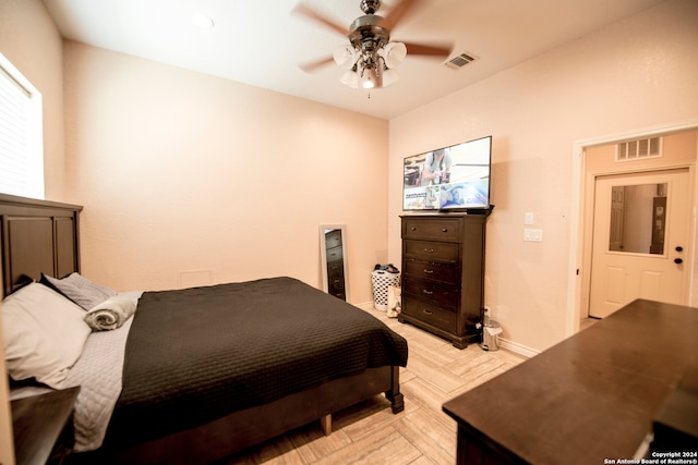 bedroom featuring ceiling fan and light parquet floors