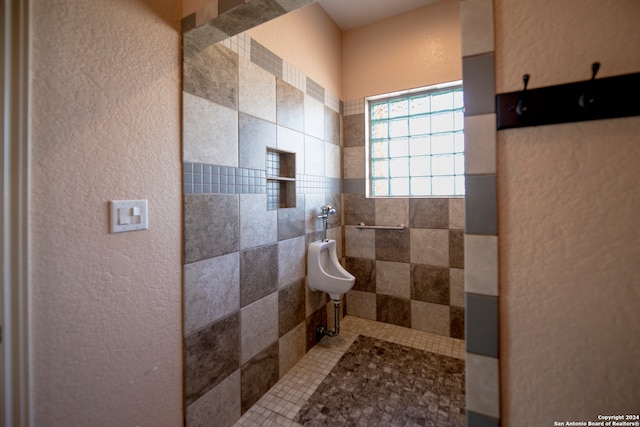 bathroom with a tile shower