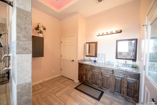 bathroom with parquet flooring and vanity