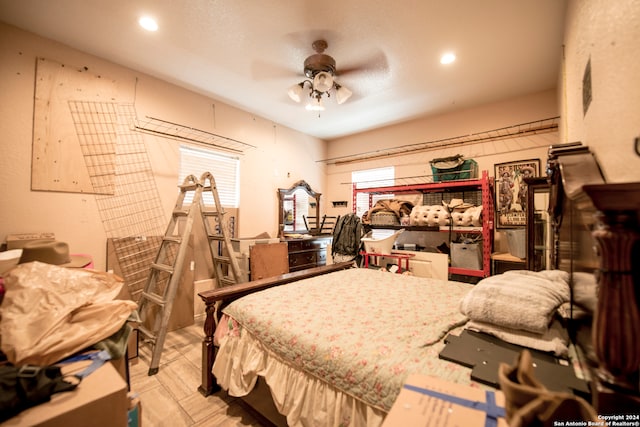 bedroom featuring multiple windows and ceiling fan