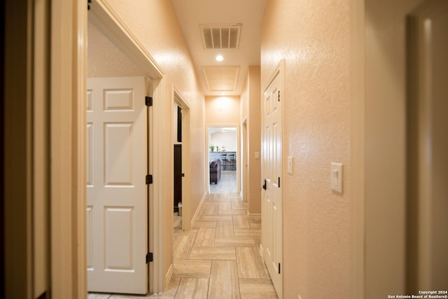 2989 Graytown, Converse, TX 78109 - corridor with a textured wall, visible vents, and attic access