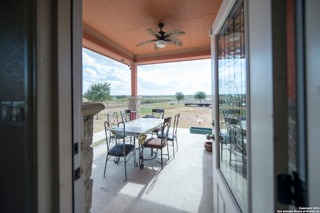 balcony featuring ceiling fan and a patio area