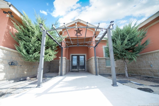 2989 Graytown, Converse, TX 78109 - view of exterior entry featuring fence, french doors, and stucco siding
