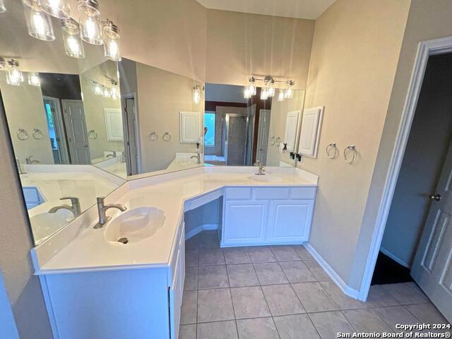 bathroom with vanity and tile patterned floors