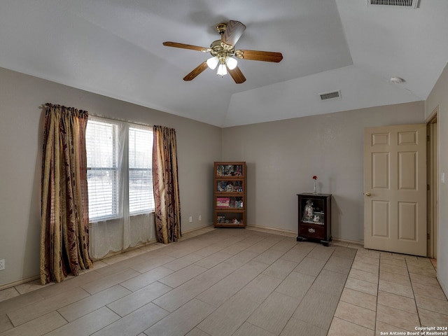 interior space with ceiling fan and vaulted ceiling