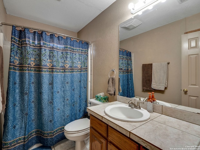 bathroom featuring a textured ceiling, a shower with shower curtain, toilet, tile patterned floors, and vanity