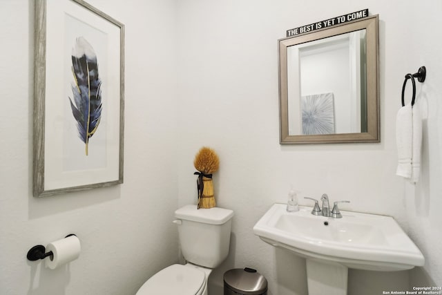 bathroom with sink and toilet