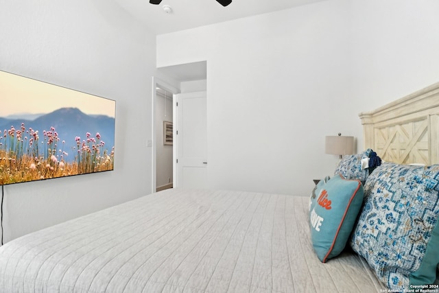 bedroom with wood-type flooring and ceiling fan