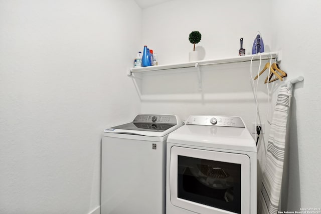 clothes washing area featuring washing machine and dryer