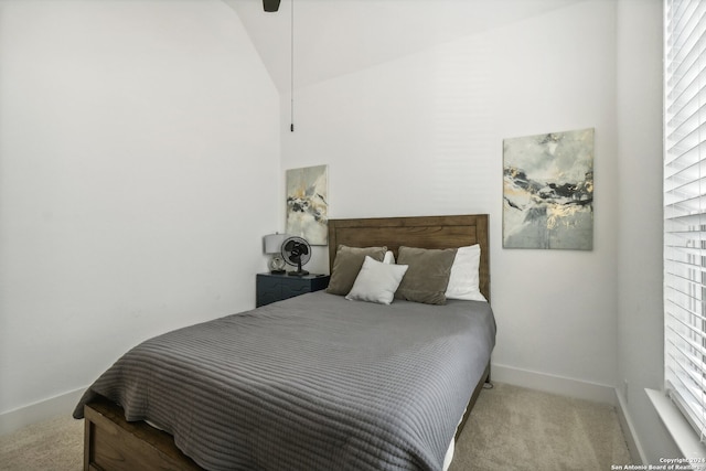 carpeted bedroom featuring vaulted ceiling