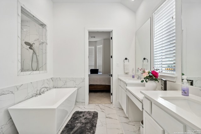 bathroom featuring vanity, plus walk in shower, and tile walls