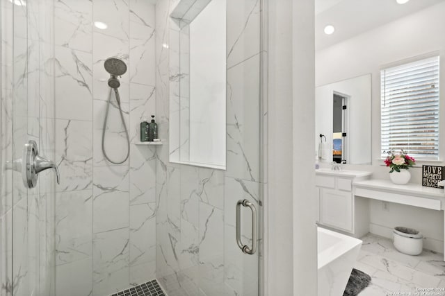 bathroom with vanity and separate shower and tub