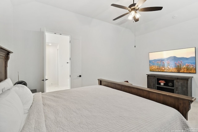 carpeted bedroom with vaulted ceiling and ceiling fan