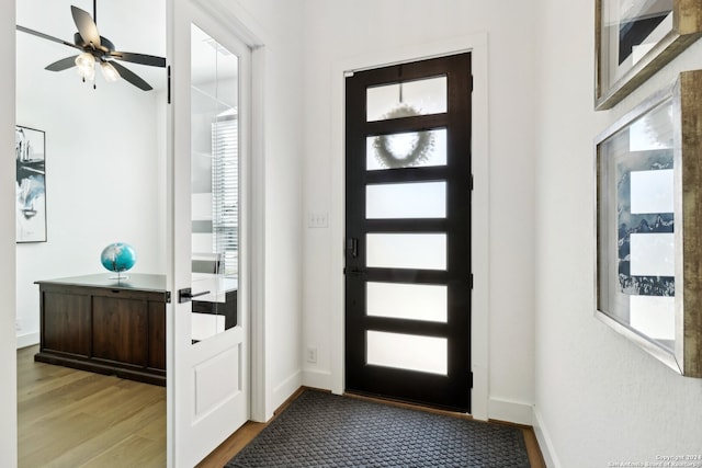 entrance foyer with light hardwood / wood-style flooring and ceiling fan