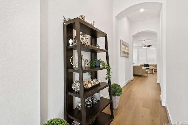 hallway with light hardwood / wood-style flooring