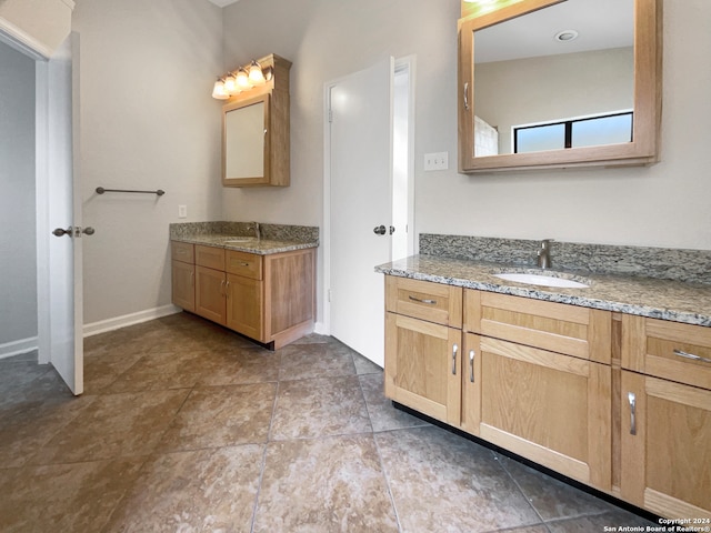 bathroom with vanity and tile patterned flooring