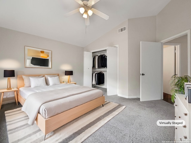 carpeted bedroom with a closet, lofted ceiling, and ceiling fan