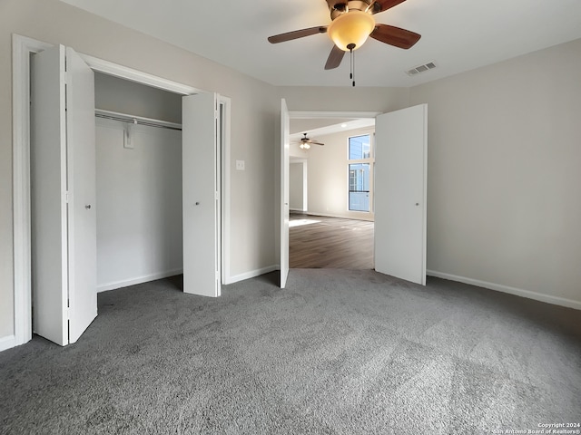 unfurnished bedroom featuring a closet, ceiling fan, and dark carpet