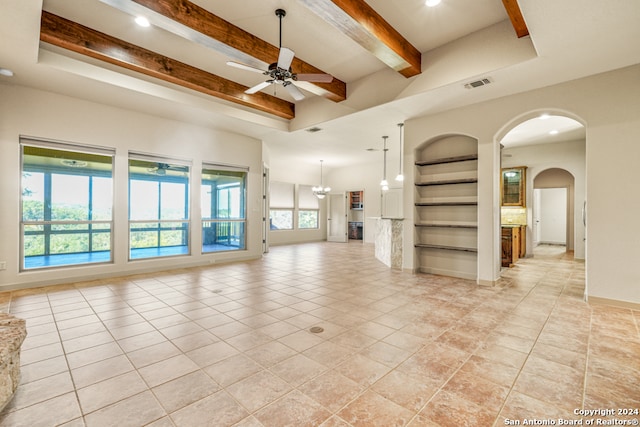 unfurnished living room featuring beam ceiling, built in shelves, ceiling fan with notable chandelier, and light tile patterned floors