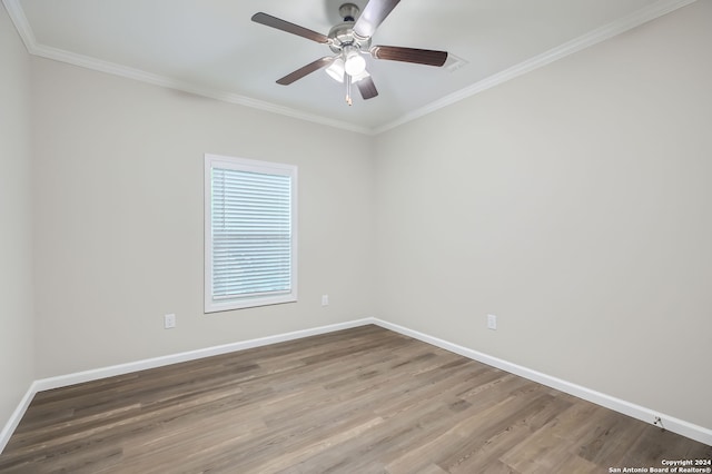 empty room featuring ornamental molding, hardwood / wood-style flooring, and ceiling fan