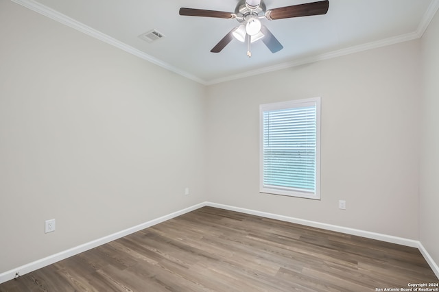 spare room featuring crown molding, hardwood / wood-style flooring, and ceiling fan