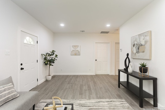 foyer with light hardwood / wood-style floors