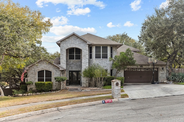 french provincial home featuring a garage