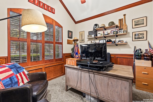 carpeted home office with ornamental molding, lofted ceiling, and wood walls