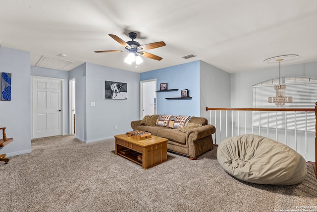 living room with light colored carpet and ceiling fan with notable chandelier