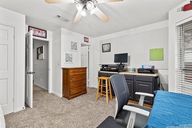 office area with light carpet and ceiling fan