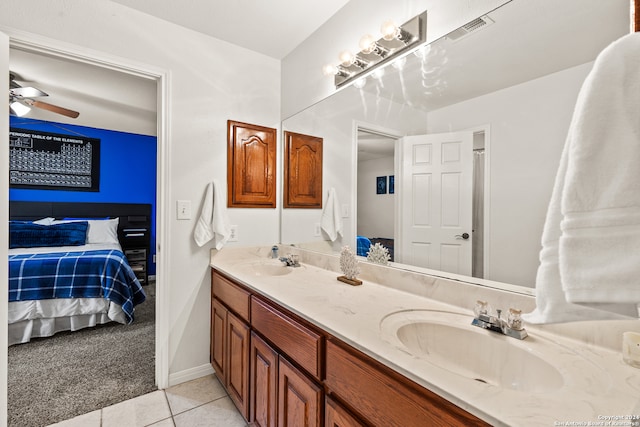 bathroom featuring vanity, ceiling fan, and tile patterned floors