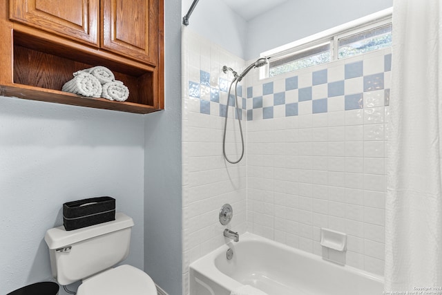 bathroom with toilet and shower / bath combo