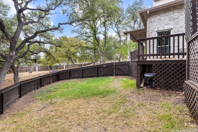 view of yard featuring a wooden deck