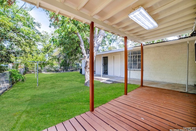 deck featuring a lawn