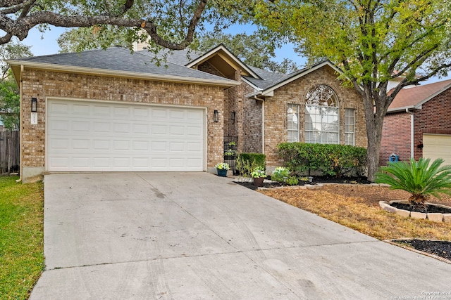 ranch-style home featuring a garage