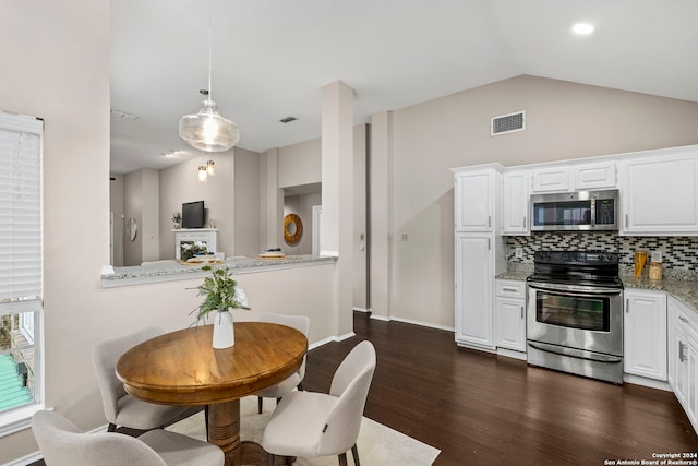 kitchen with decorative backsplash, white cabinets, stainless steel appliances, and dark wood-type flooring