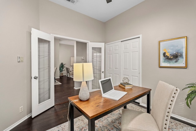 office space featuring french doors and dark hardwood / wood-style flooring