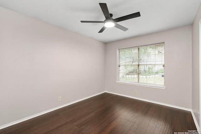 unfurnished room featuring ceiling fan and dark hardwood / wood-style flooring