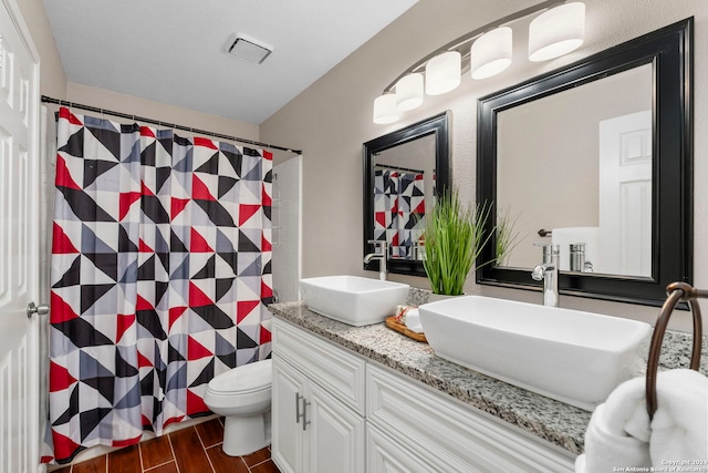 bathroom featuring vanity, a shower with curtain, wood-type flooring, and toilet