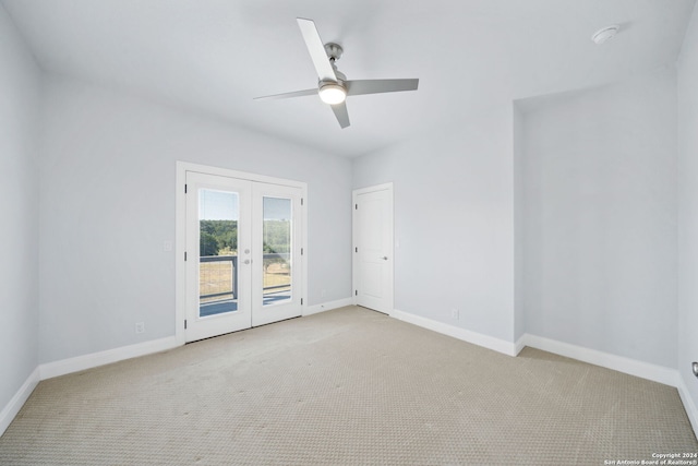 carpeted spare room with french doors and ceiling fan