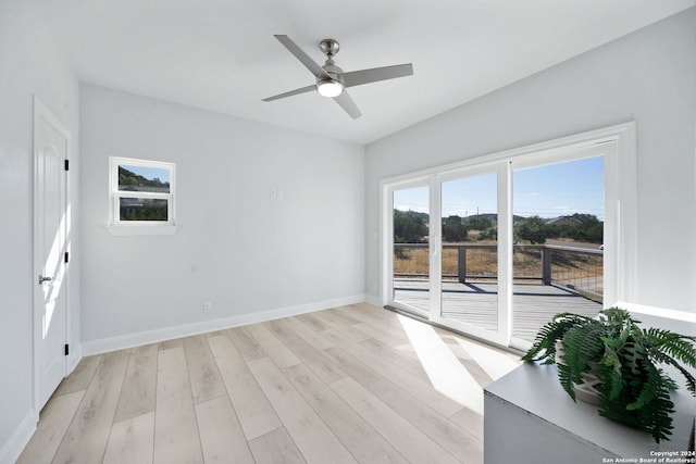 unfurnished room with light hardwood / wood-style floors and ceiling fan