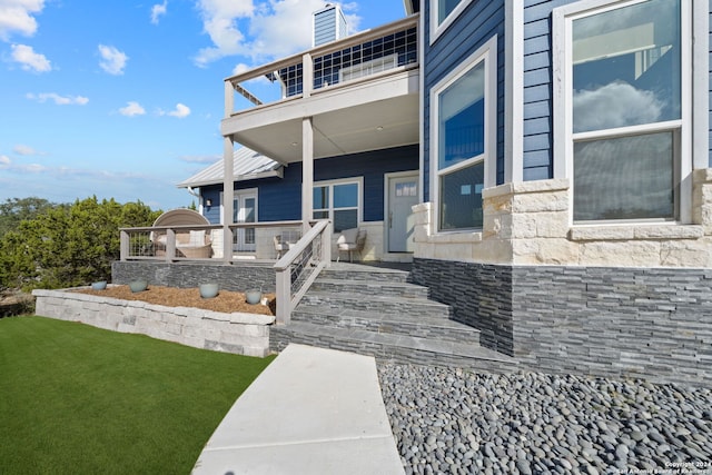 doorway to property with a balcony