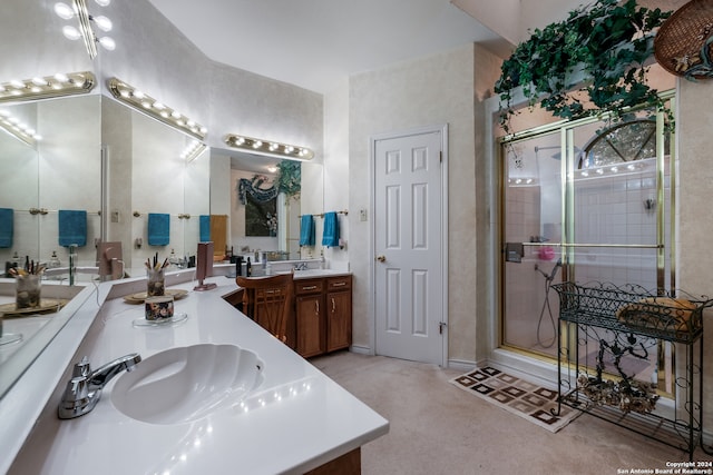 bathroom featuring vanity and an enclosed shower