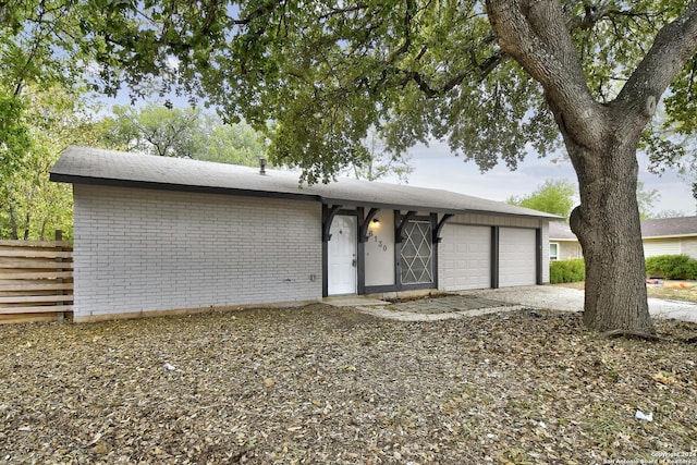 ranch-style home featuring a garage